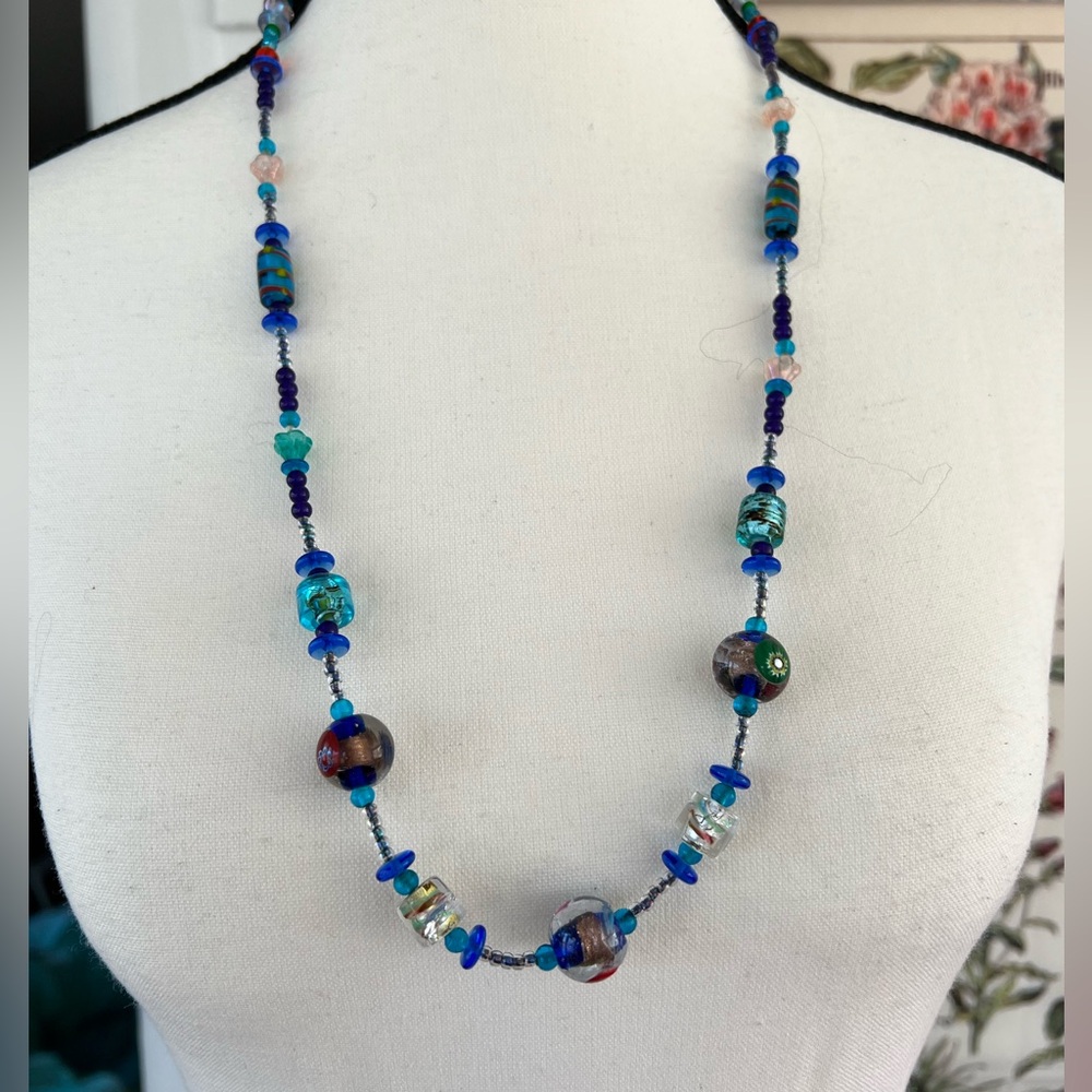 Art glass beads and seed bead necklace 28” long. In blues, reds, greens, clear.